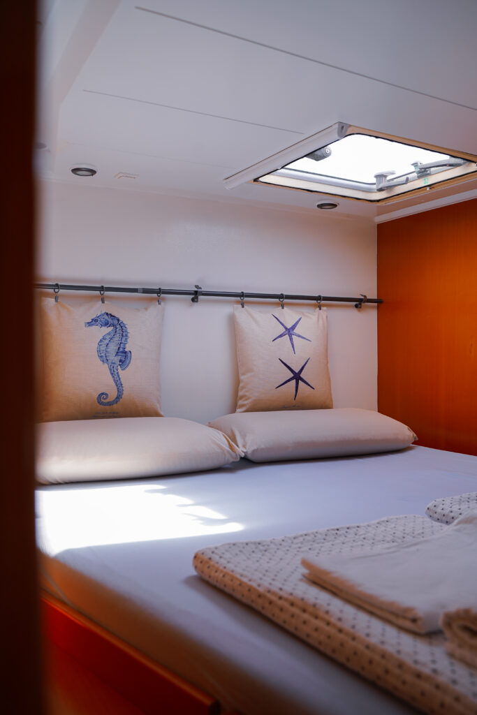 Bed inside the cabin of the catamaran Eragon