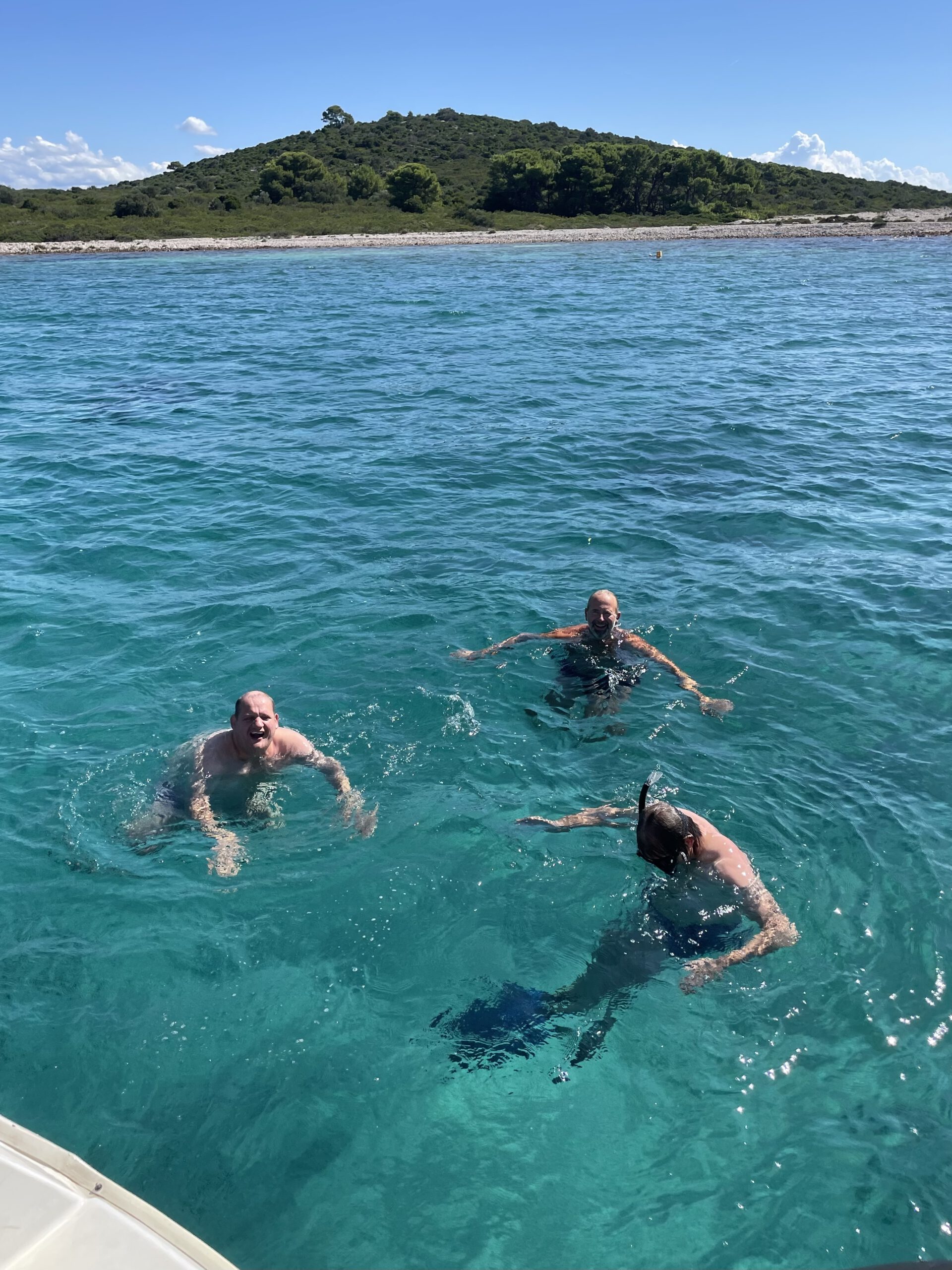 Guests swimming and snorkelling in turquoise waters in Croatia